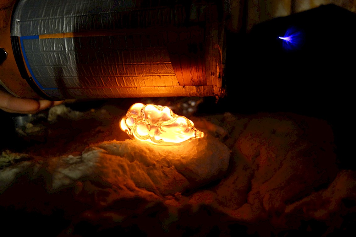 Filling the glass sculpture at Tesla coil lab in Sankt Petersbourgh